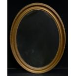 An early 20th century oval looking glass, gilt frame, 89cm x 62cm