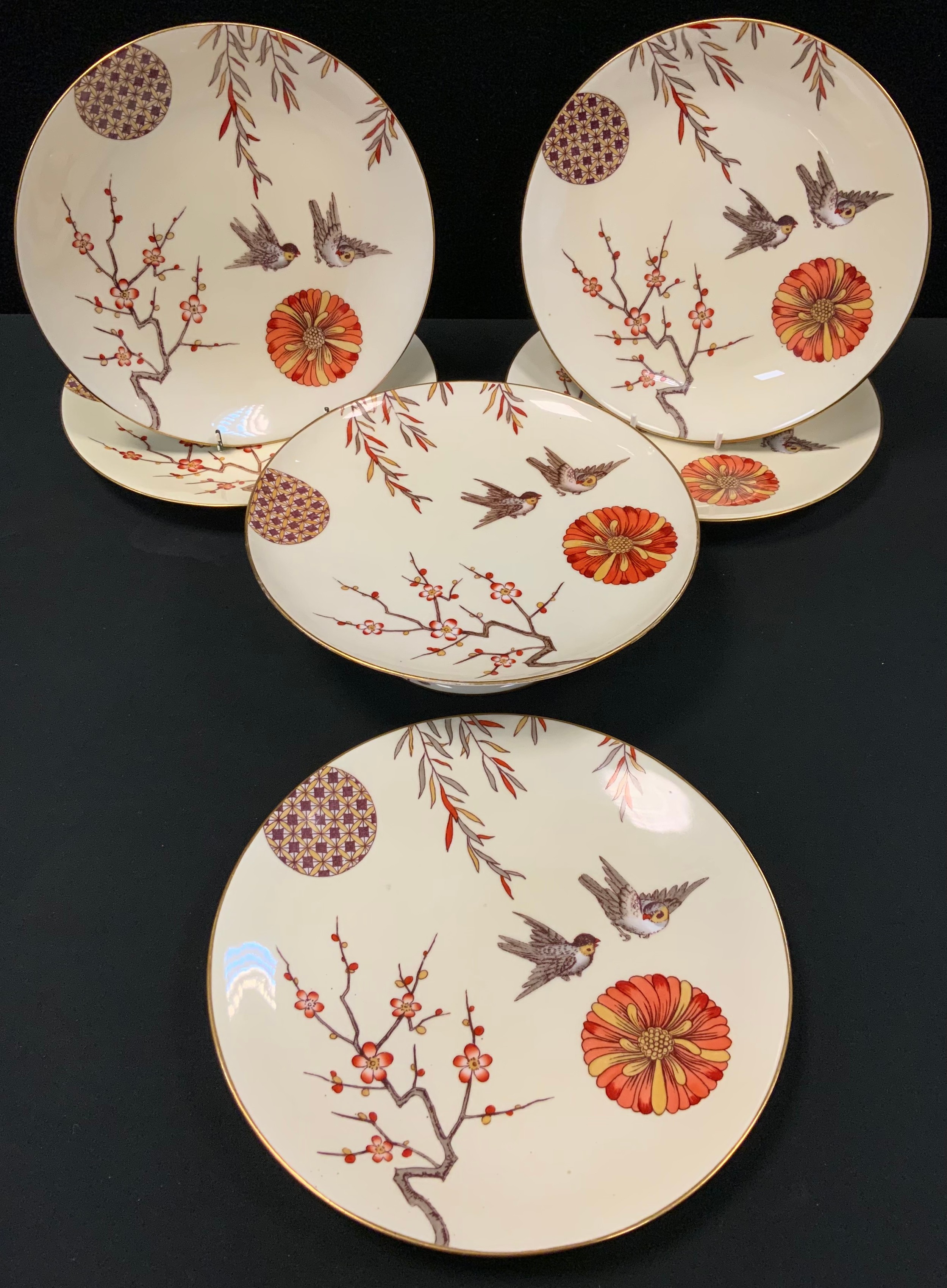 A late 19th century Minton Aesthetic Movement dessert service, comport, five plates, decorated in