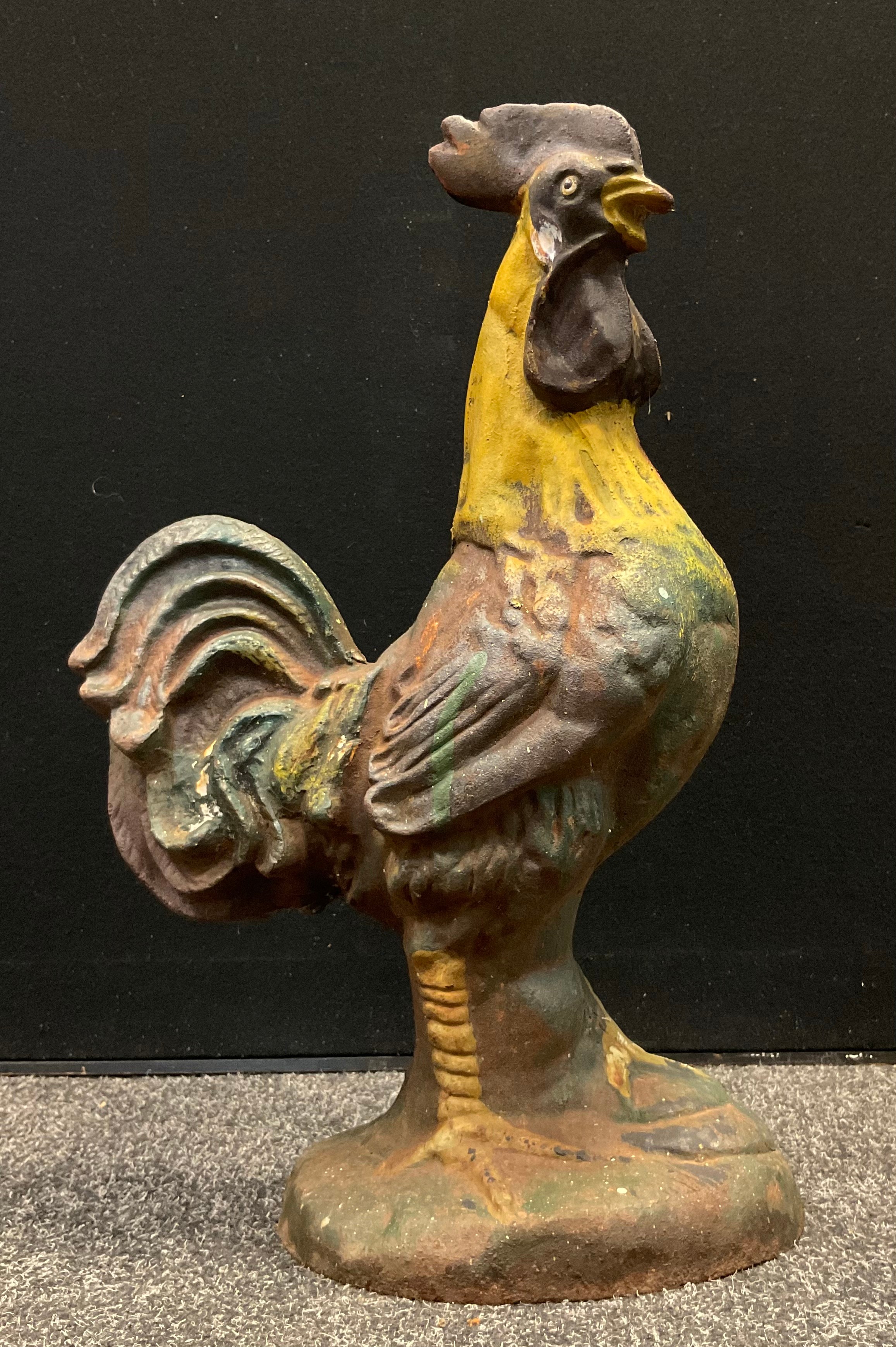 An early 20th century cast iron, life-size model of a cockerel, 55cm tall.