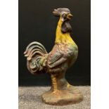 An early 20th century cast iron, life-size model of a cockerel, 55cm tall.