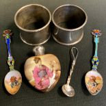 Two Continental silver and enamelled coffee spoons, enamelled with Sphinx, marked 800; two silver