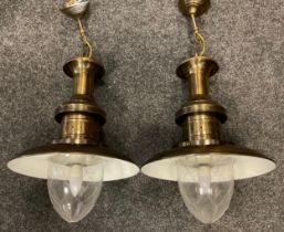 A pair of contemporary Industrial style pendant light fittings, brushed brass finish, white enamel