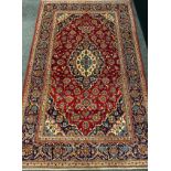 A central Persian Kashan rug / carpet, 320cm x 205cm.