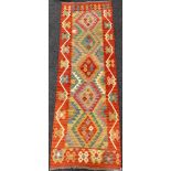 An Anatolian Kilim rug / carpet runner, 247cm x 83cm.