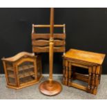 An early 20th century mahogany standard lamp; an oak wall mountable display cabinet, serpentine top,