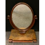 An early Victorian mahogany dressing table mirror, oval glass, 72cm tall x 52.5cm wide.