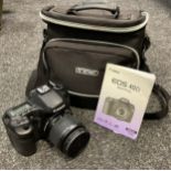 A Canon EOS 40D digital camera with canon 18-55mm f3.5-5.6 lens, with camera bag, charger, and spare