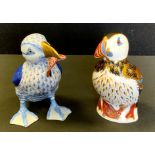 A Royal Crown Derby paperweight, Puffin, gold stopper; a Herend porcelain figure Puffin with