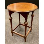 An Arts and Crafts style oak side table, circular top, turned supports, 72cm tall x 57.5cm diameter,