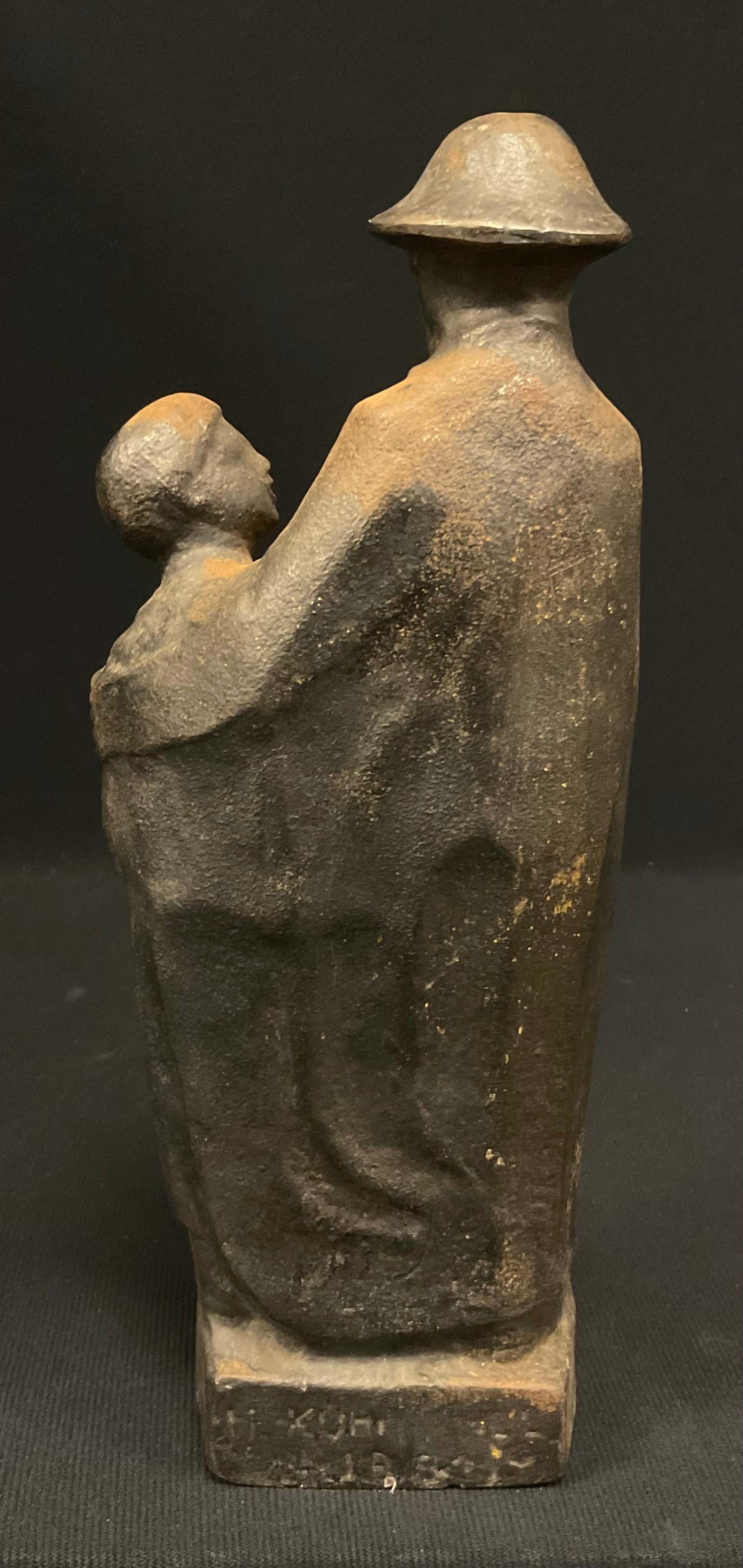 M Kuh**, a patinated iron sculpture, Figure and Boy with a hammer, signed and inscribed in the - Image 4 of 5
