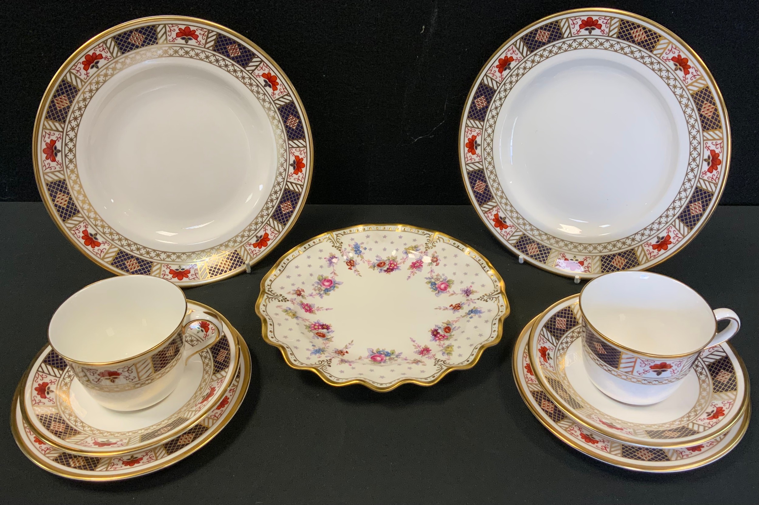 A pair of Royal Crown Derby Derby Border pattern trios, two side plates, Royal Antoinette wavy rim