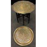A Benares dodecagonal brass top table, embossed decoration, folding base, 56cm high; 72cm