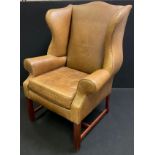 A mid 20th century, Queen Anne style leather wing-back armchair, 116cm tall x 84cm wide. (this chair