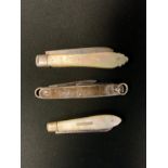 A Victorian mother-of-pearl and silver fruit knife, Sheffield 1905; another similar; a silver