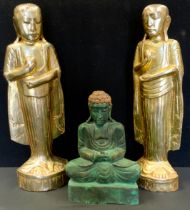 A pair of Buddhist carved and gilded figures, as Monks each holding a stupa, 50cm high; another