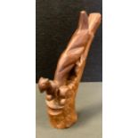 A Black forest style carved nutcracker, as a Squirrel on tree stump, approx 20cm long