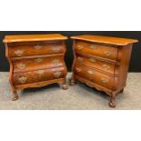 A near pair of French oak bedside commode chests, shaped rectangular tops, three drawers, carved