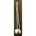 A Mexican silver and grey cultured pearl necklace, shaped silver pendant stamped TN-49, Mexico, 925,