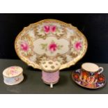 A Wedgwood hand painted shaped oval tray, painted with pink roses; Lynton porcelain coffee can and