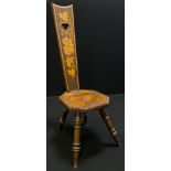 A Victorian pokerwork spinning chair, decorated with fruiting vines to back and seat, turned legs,
