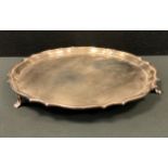 A George VI silver salver, shaped edge, tripod feet, 31.5cm diameter, Cooper Brothers & Sons Ltd,