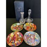 A Stuart Crystal ships decanter; another Port; four Royal Doulton Spellbinder collectors plates