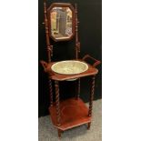 An early 20th century two tier washstand, octagonal mirror above canted square top inset F Wileman