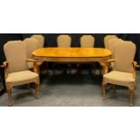 A 20th century reproduction Walnut Dining Table And Eight Chairs by Hille & Co London, the table