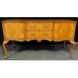 A mid 20th century burr walnut, inverted breakfront sideboard, made for Hille of London, finely