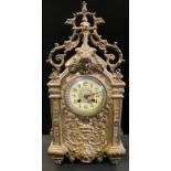 A 19th century H P & Co mantel clock, silvered metal case cast with mask head and scrolling foliate,