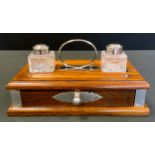 A Sheafer silver mounted standish, oak single drawer stand, twin lidded inkwells, loop handle,