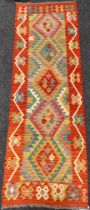 An Anatolian Kilim rug / carpet runner, 247cm x 83cm.