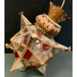 A patinated metal, red and clear glass star lantern, possibly Moroccan, approx 40cm x 27cm