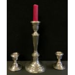 A pair of silver squat candlesticks, weighted bases, Birmingham 1975, 198g gross; a Gorham