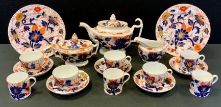 An early 19th century tea set, probably Coalport, teapot, sucrier and milk jug, assorted cups,