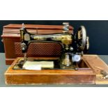 A Singer sewing machine, cased