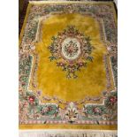 A large Chinese floral carpet, yellow ground, 374cm x 278cm.