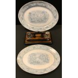 A Victorian ebonised standish; two graduated oval Rhine pattern Staffordshire meat plates (3)