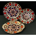 A Royal Crown Derby oval 1128 Imari boat dish, acorn handles, 29cm long; conforming dinner plate,