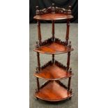 A Victorian mahogany four tier What-not, turned finials and supports, carved back rails, 141cm