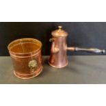 A 19th century Arts and Crafts copper teapot, tapering conical body, heart mount, turned handle;