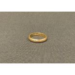 An 18ct gold wedding band, size N, 4.1g