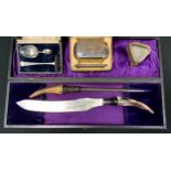 A George V silver mounted brush and comb, Birmingham 1926, case; horn hafted carving knife etc