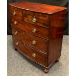 A Victorian bow-front chest, two short over three long graduated drawers, turned feet, 115cm tall