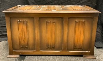 A 20th century oak three panel blanket chest, carved linen-fold decoration to panels, 50cm tall x