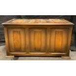 A 20th century oak three panel blanket chest, carved linen-fold decoration to panels, 50cm tall x