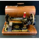 A Singer hand operated sewing machine