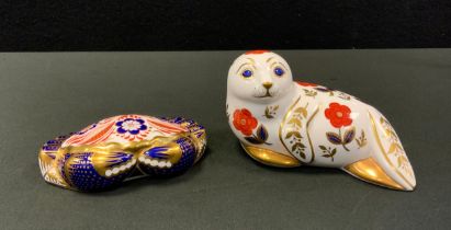 A Royal Crown Derby Paperweight Seal, gold stopper; another Crab, silver stopper (2)