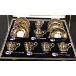 A mid 20th century Aynsley gilded tea service for six with enamelled silver teaspoons en suite,