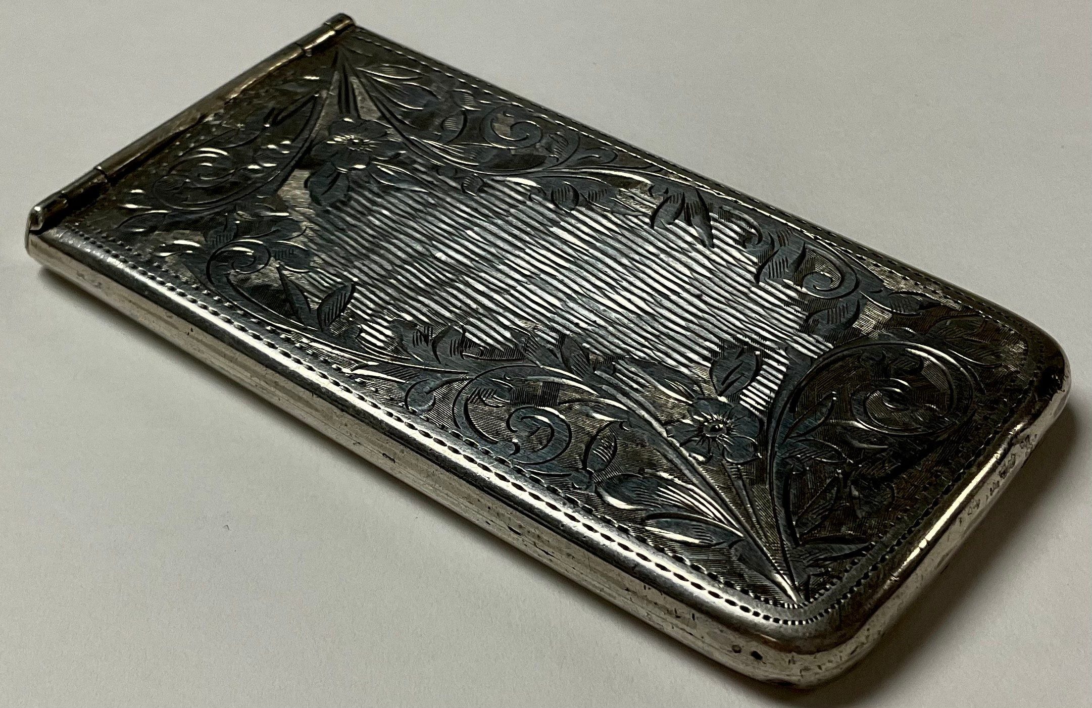 An Edward VII silver visiting card case, chased and engraved with foliate scrolls, patented silver - Image 2 of 2